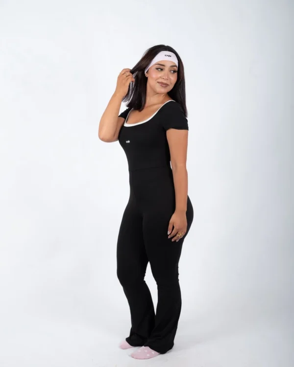 Black open back flare jumpsuit by Chai Nest