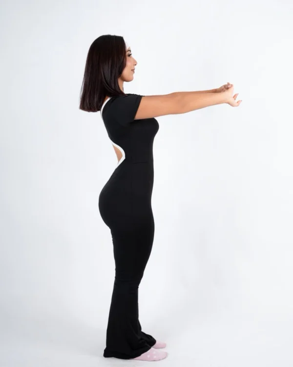 Black open back flare jumpsuit by Chai Nest – view 3