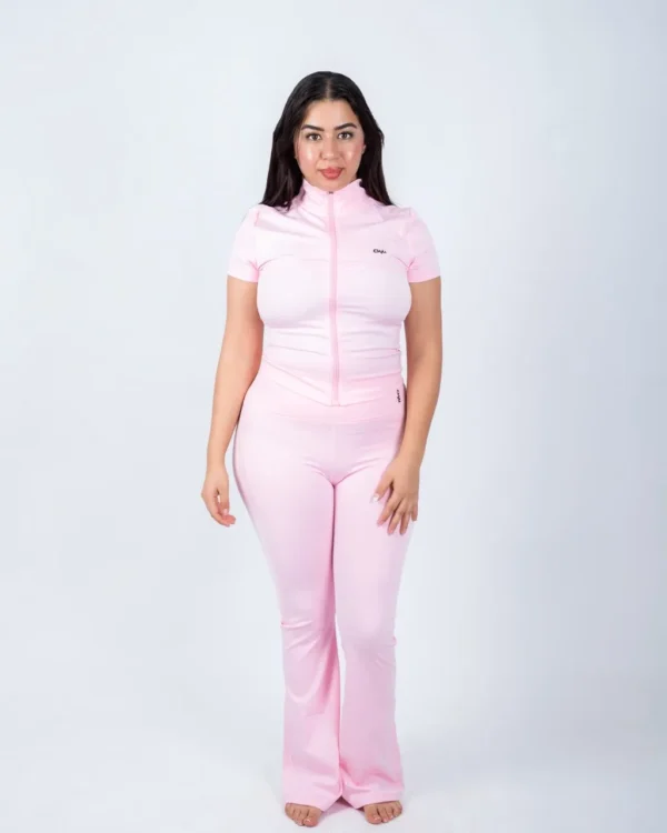 Pink zip top and flare pants set by Chai Nest